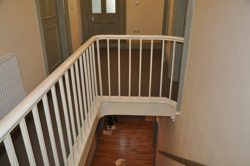 A clean and tidy hallway with a welcoming atmos...