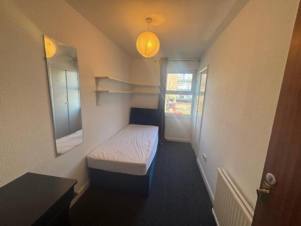 Bright and inviting double bedroom featuring a ...