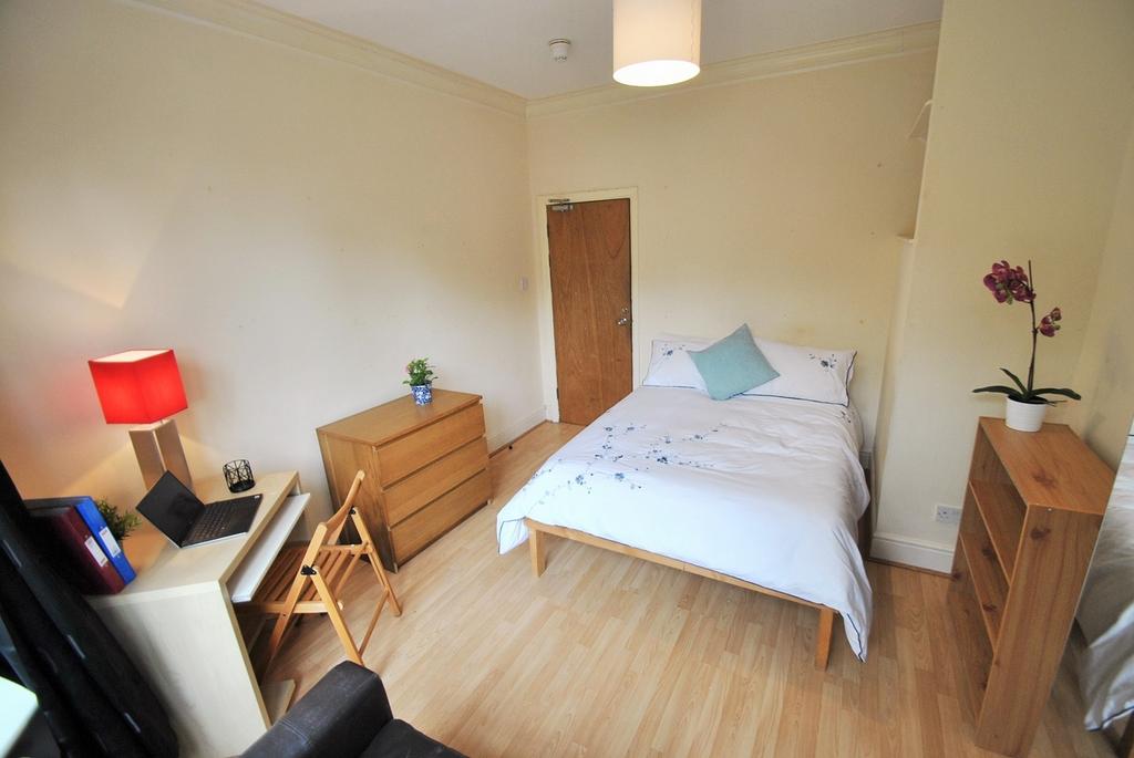 A stylish and inviting double bedroom featuring...