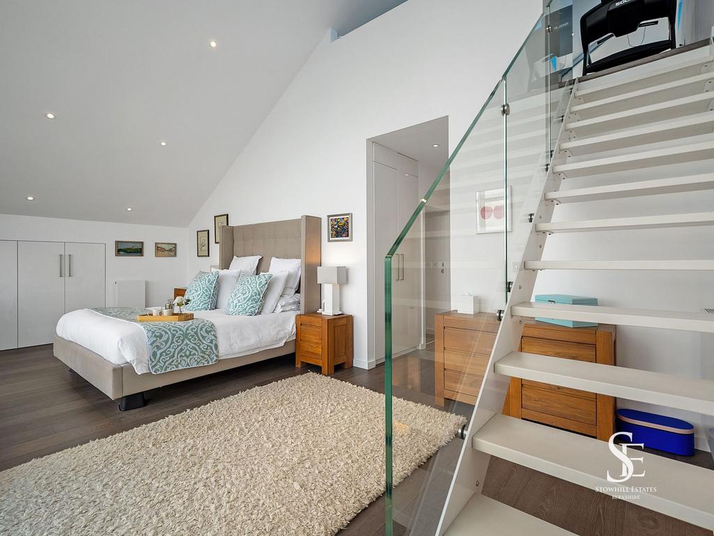 Principal Suite stairs to mezzanine