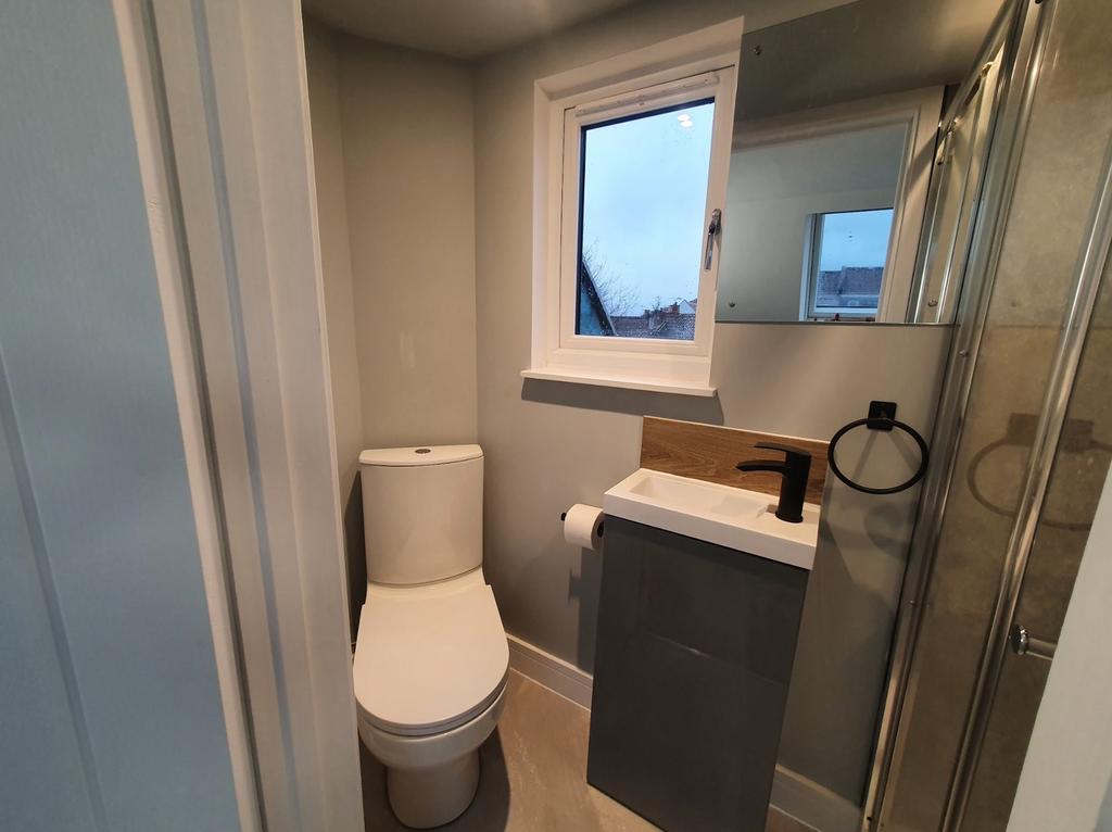 This modern bathroom features a sleek design wi...