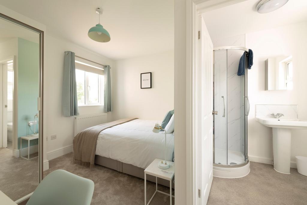 A beautifully designed double bedroom featuring...