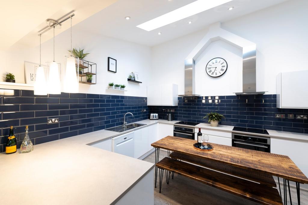 This stylish kitchen features modern appliances...