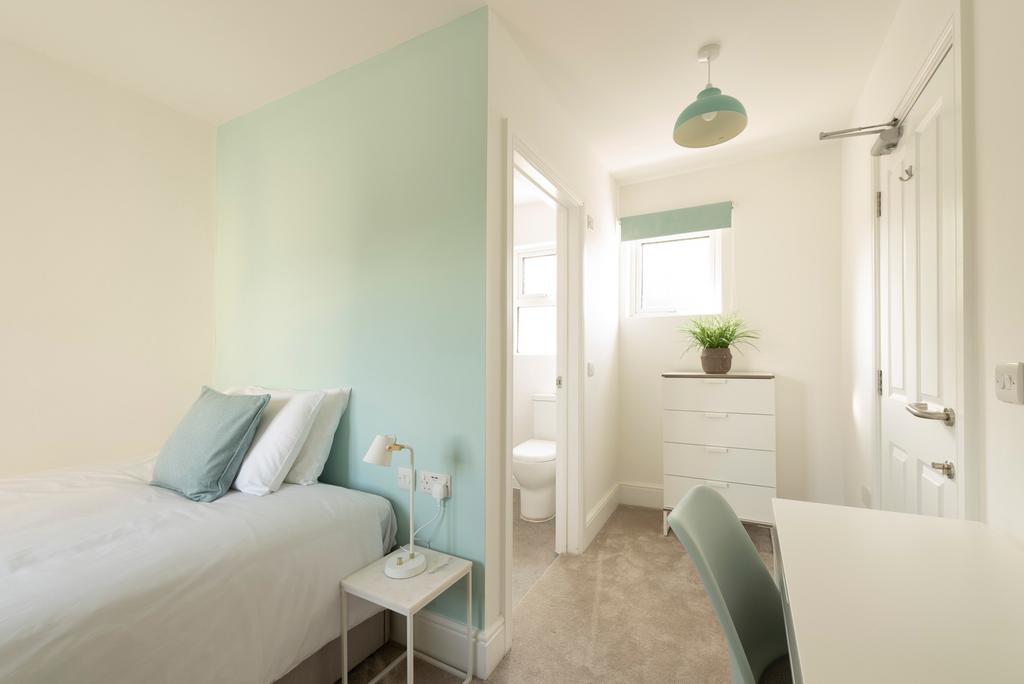A bright and inviting double bedroom featuring ...