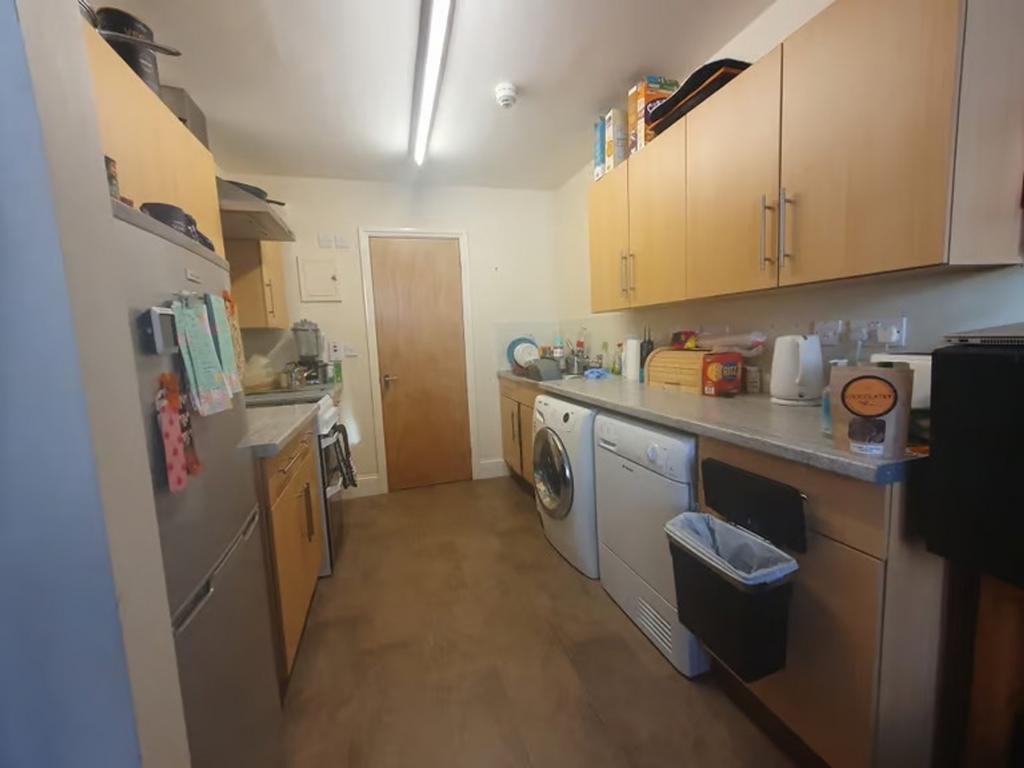 This modern kitchen boasts ample storage with s...