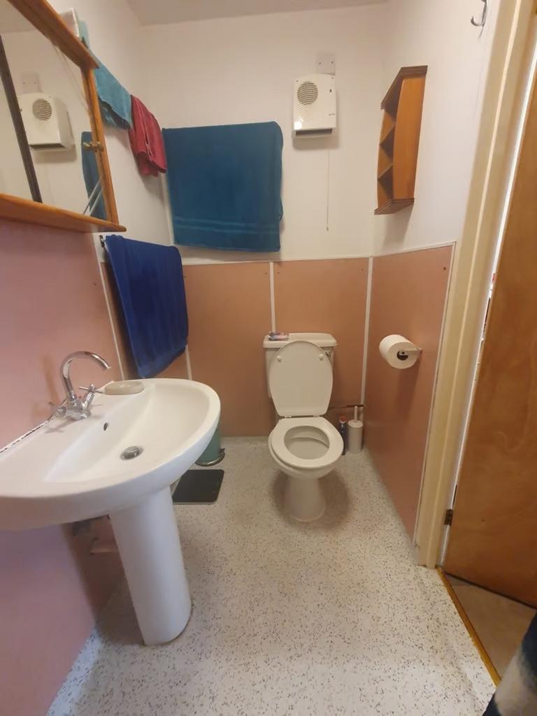 A well-maintained bathroom featuring a modern s...