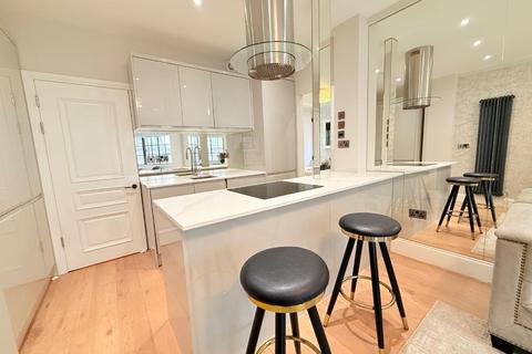 Flat 2, 88 Portland Place, London, W1B 1NX