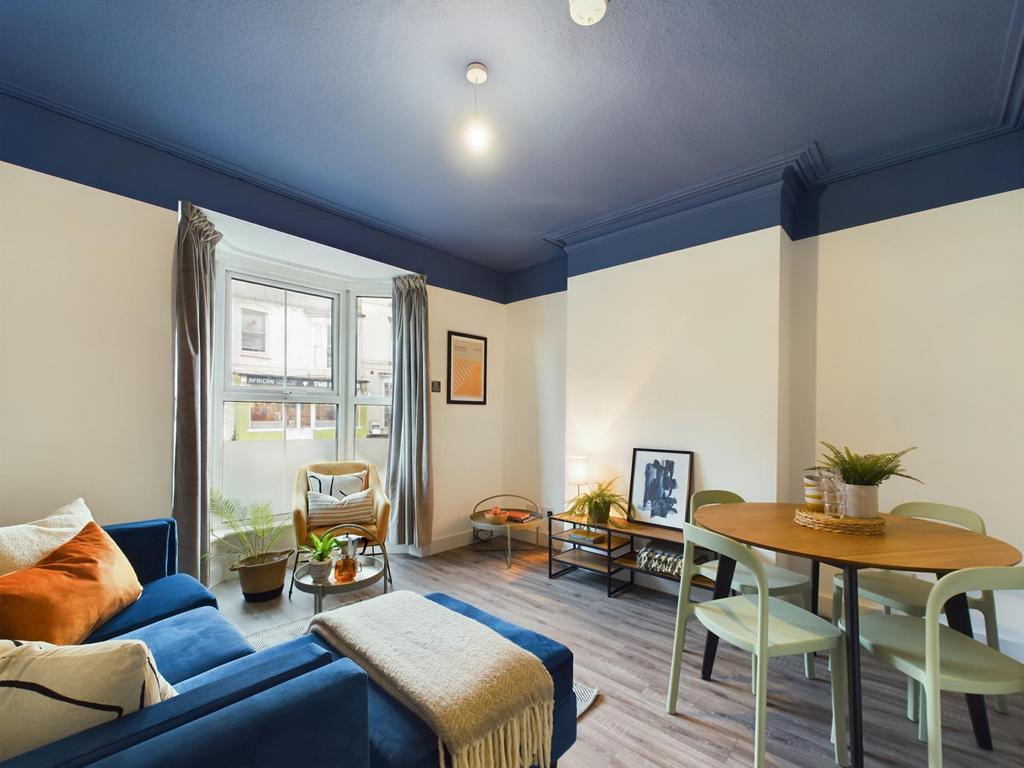 Bright and inviting living room featuring natur...