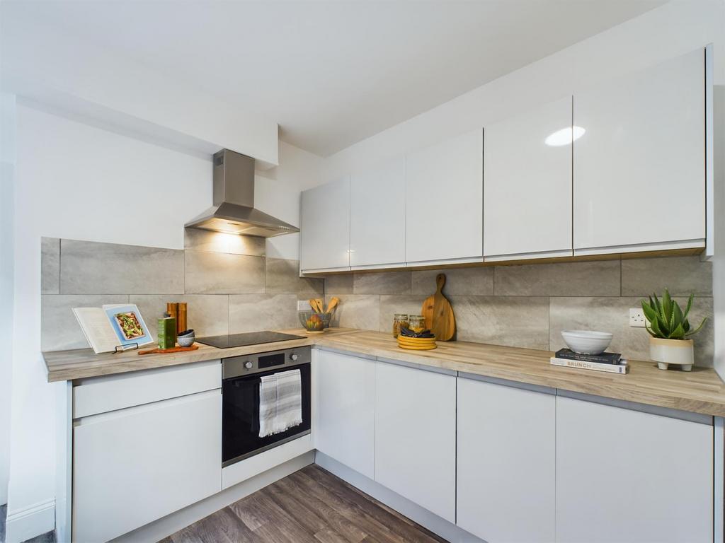 Modern and well-maintained kitchen with sleek w...