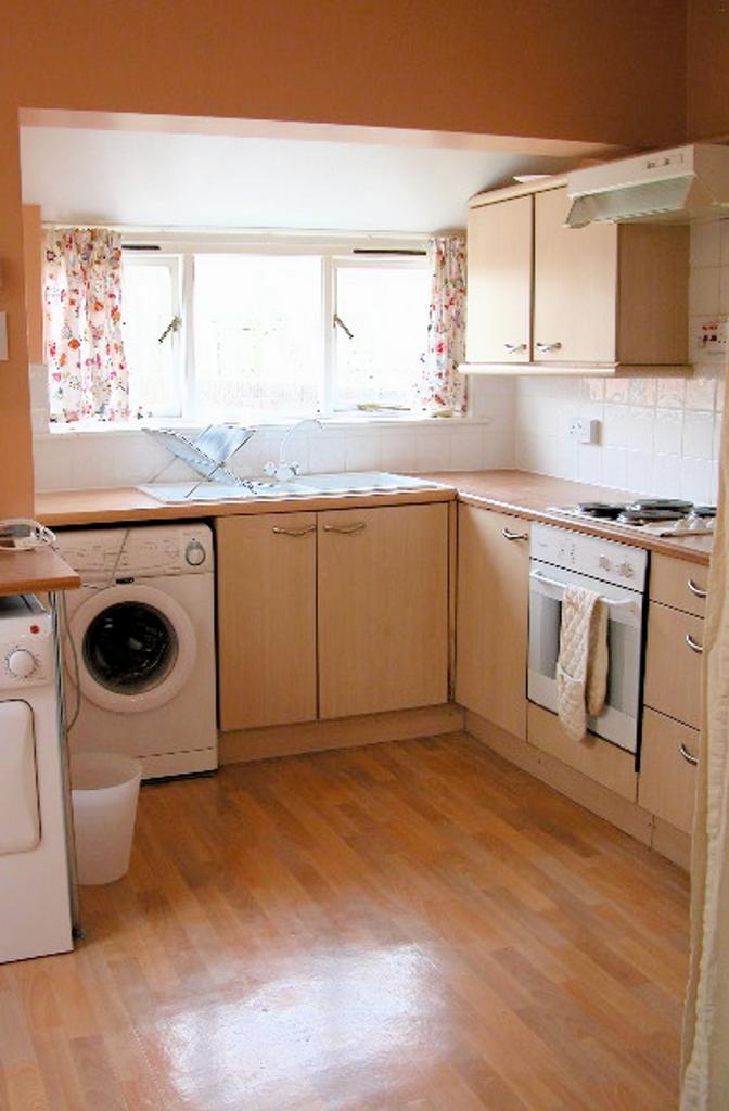 A bright and functional kitchen featuring moder...