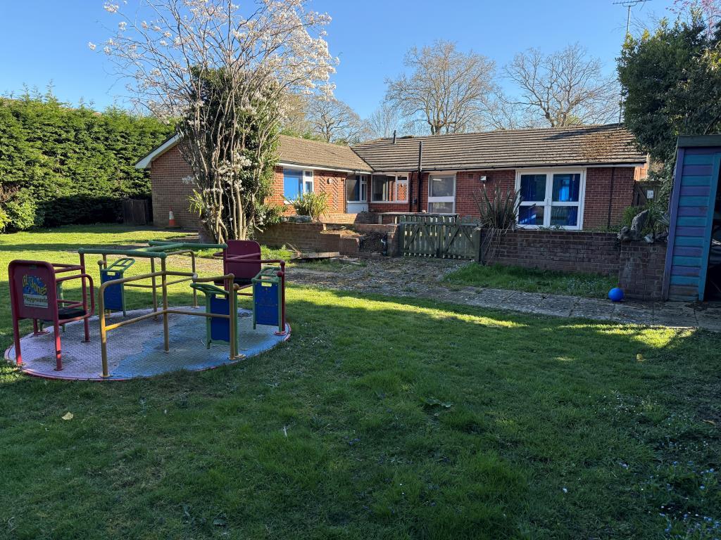 Rear of property with children's play area