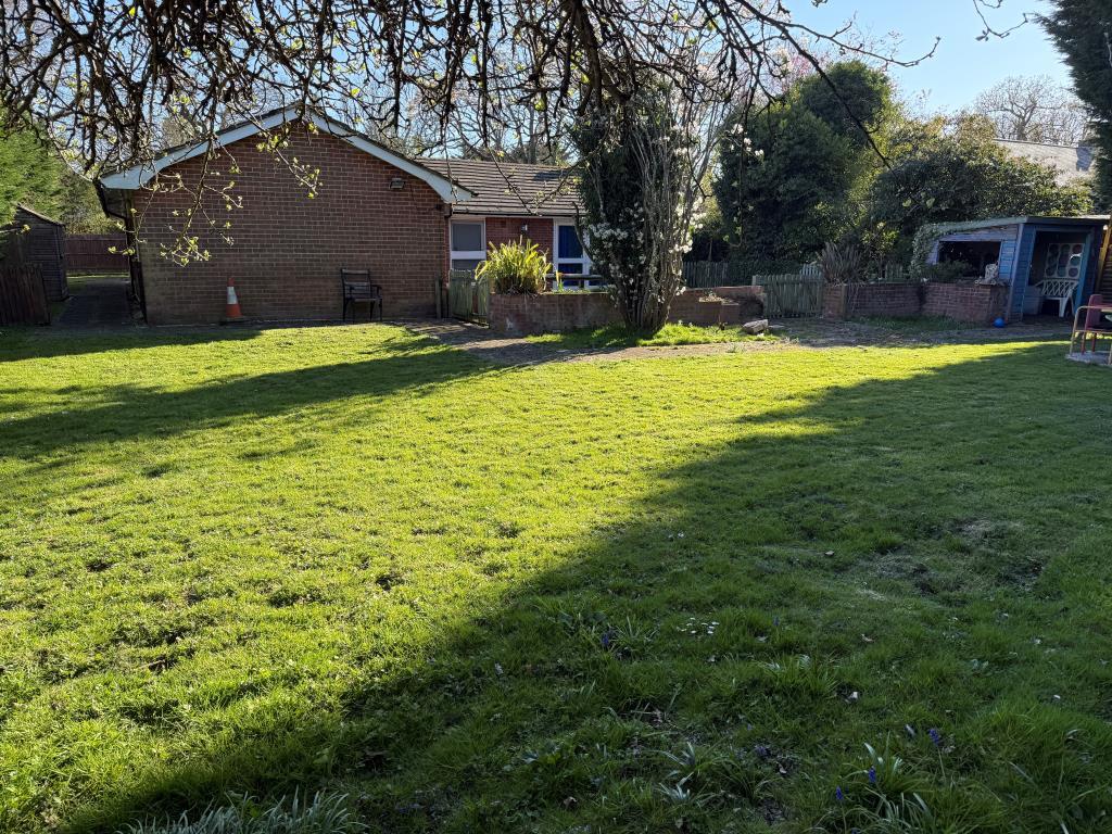 Lawned rear garden with store