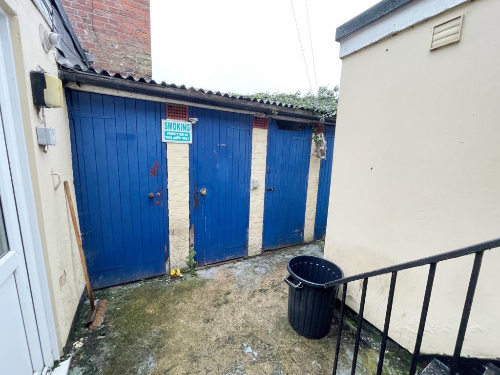 Storage sheds to the rear of the building