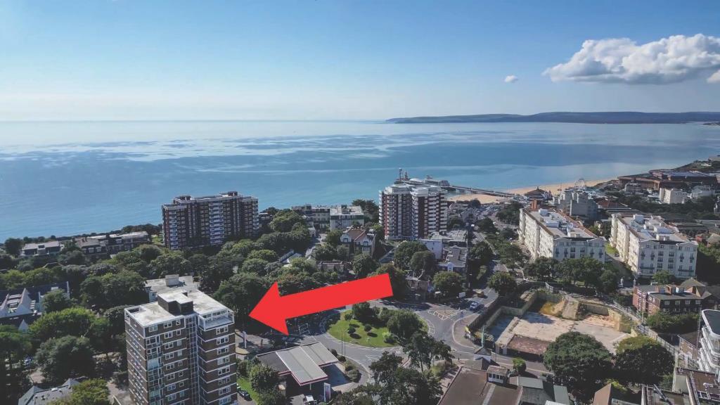 Drone photo of the building with the sea in the ba