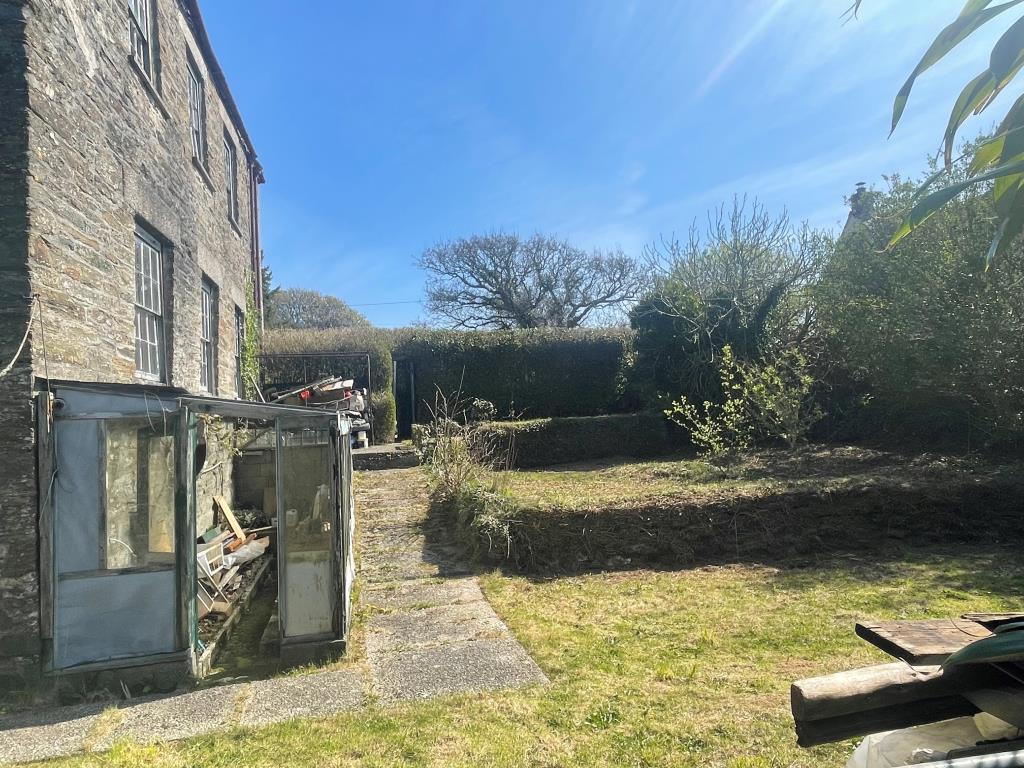 Side elevation of property and garden space with g