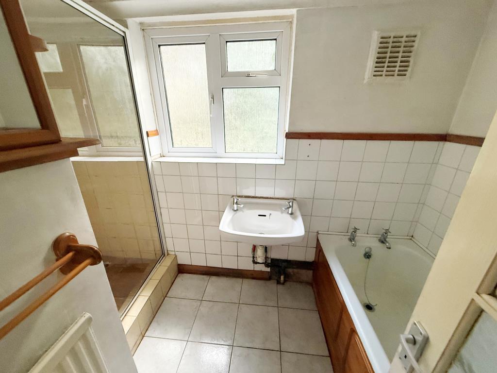 Bathroom with bath and shower