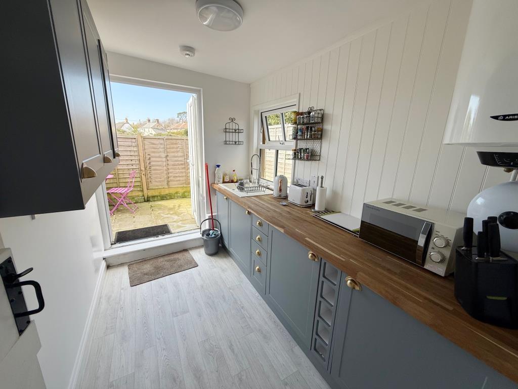 Kitchen with doors to rear