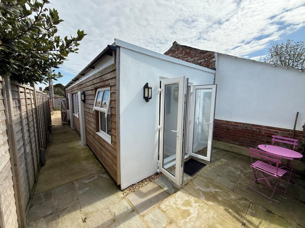 Rear view of the building with patio doors