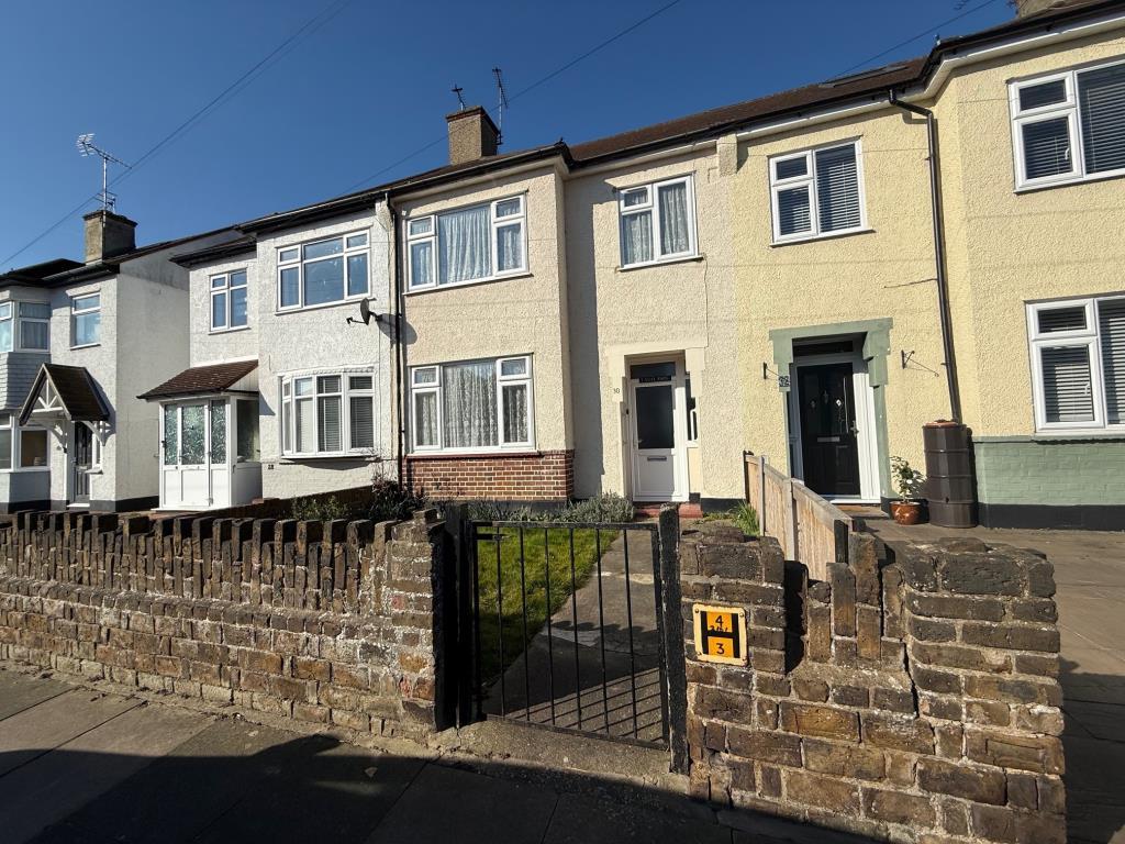 Enclosed front garden with path leading to front d
