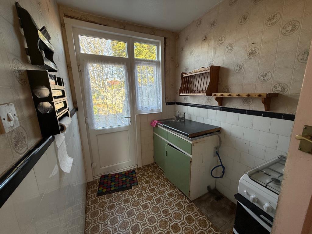 Kitchen area with door opening to rear garden