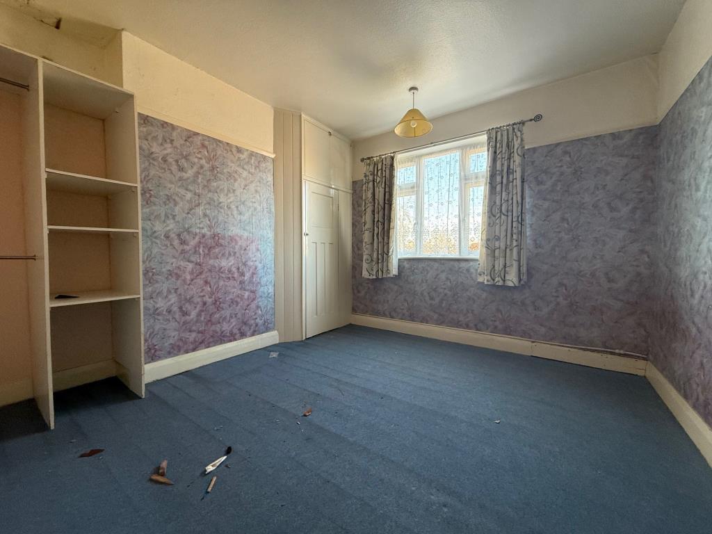 Double bedroom with window to rear aspect
