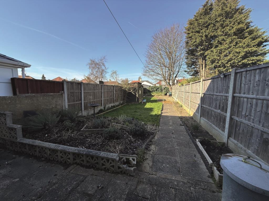 Patio area with path leading to end of garden with