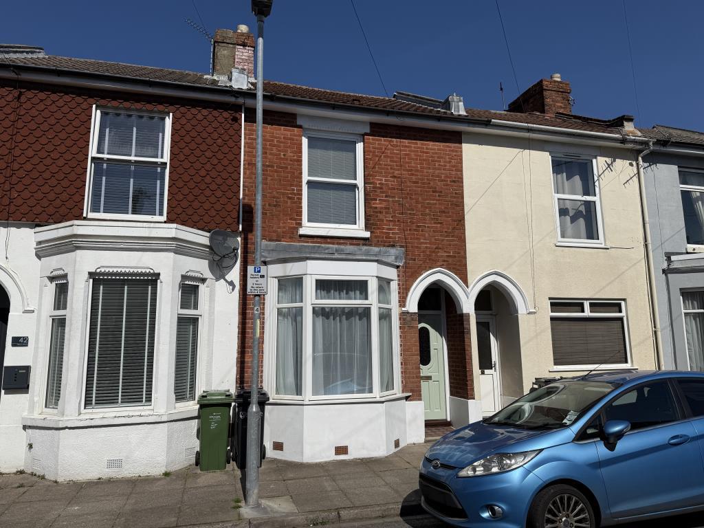 Mid terrace property with bay window to ground flo