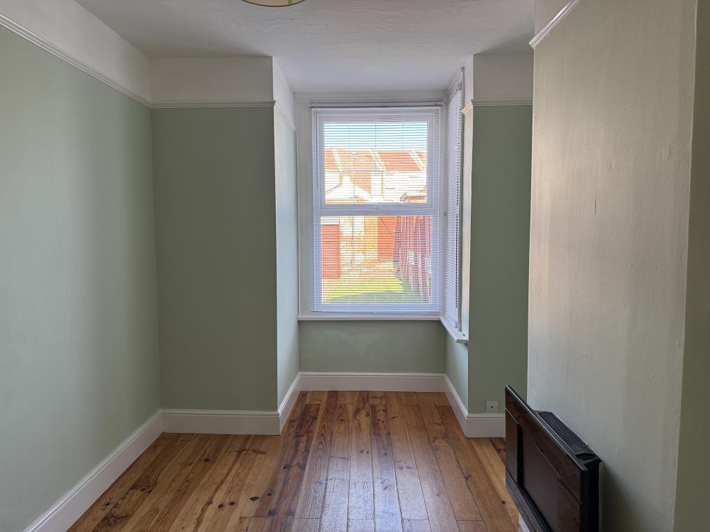 Dining room with painted walls and wooden floor