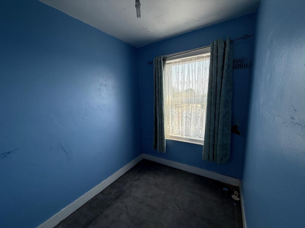 Bedroom 3 with double glazed window to rear