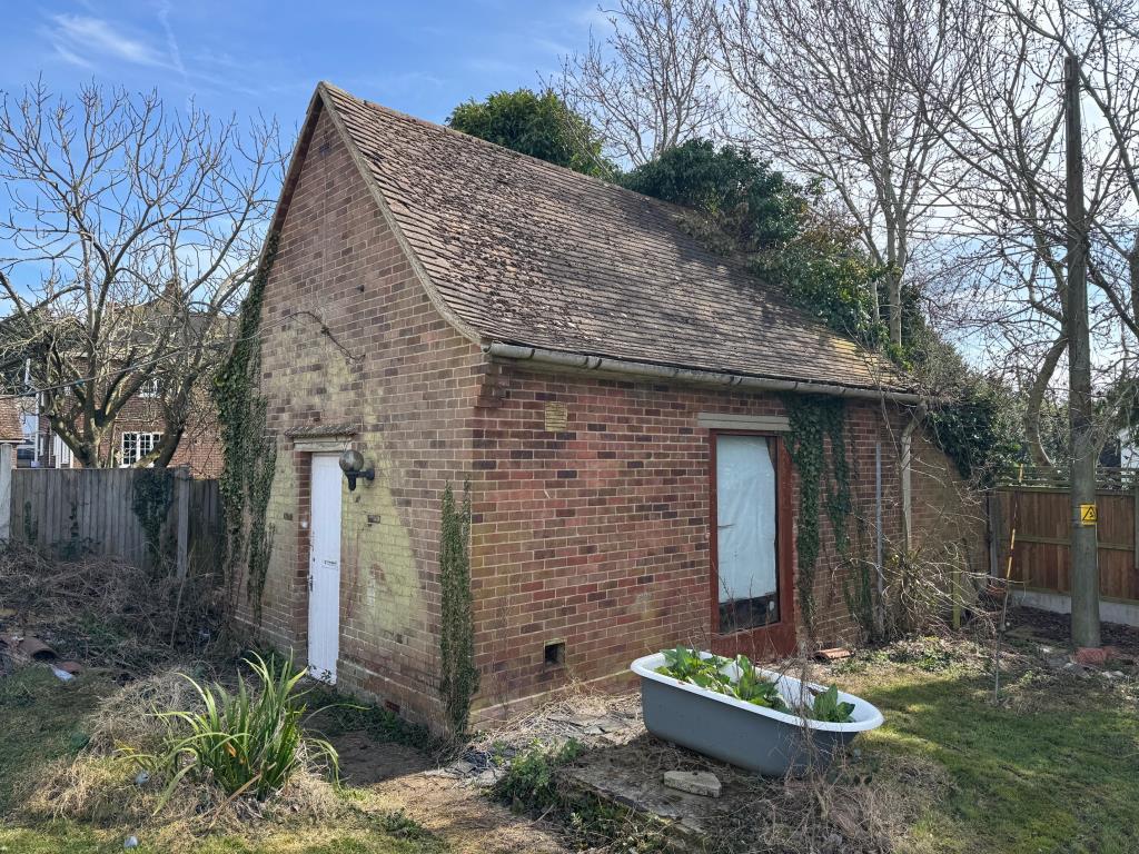Outbuilding in garden