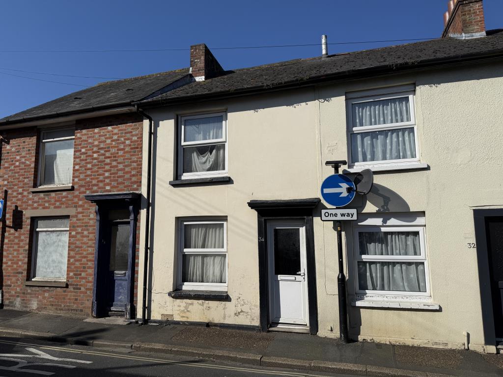 Mid terrace house rendered and painted