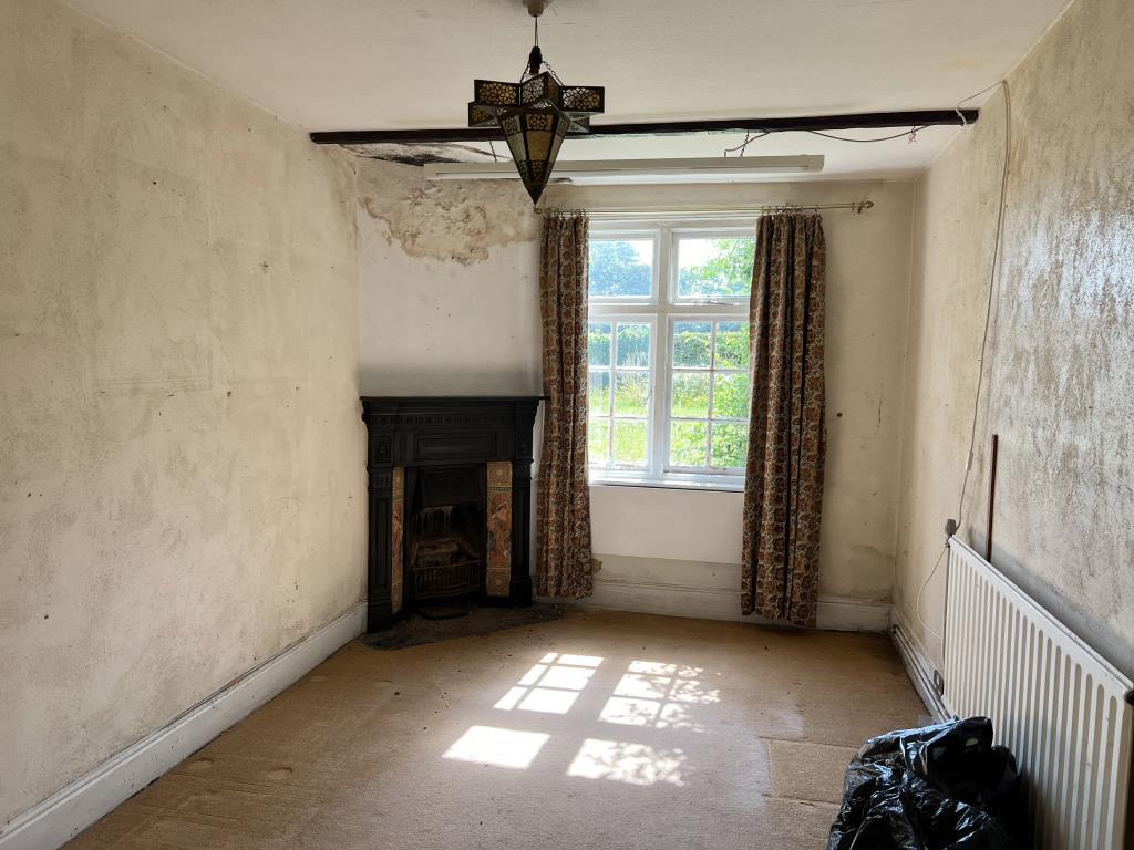 Dining room with fireplace and window to front gar