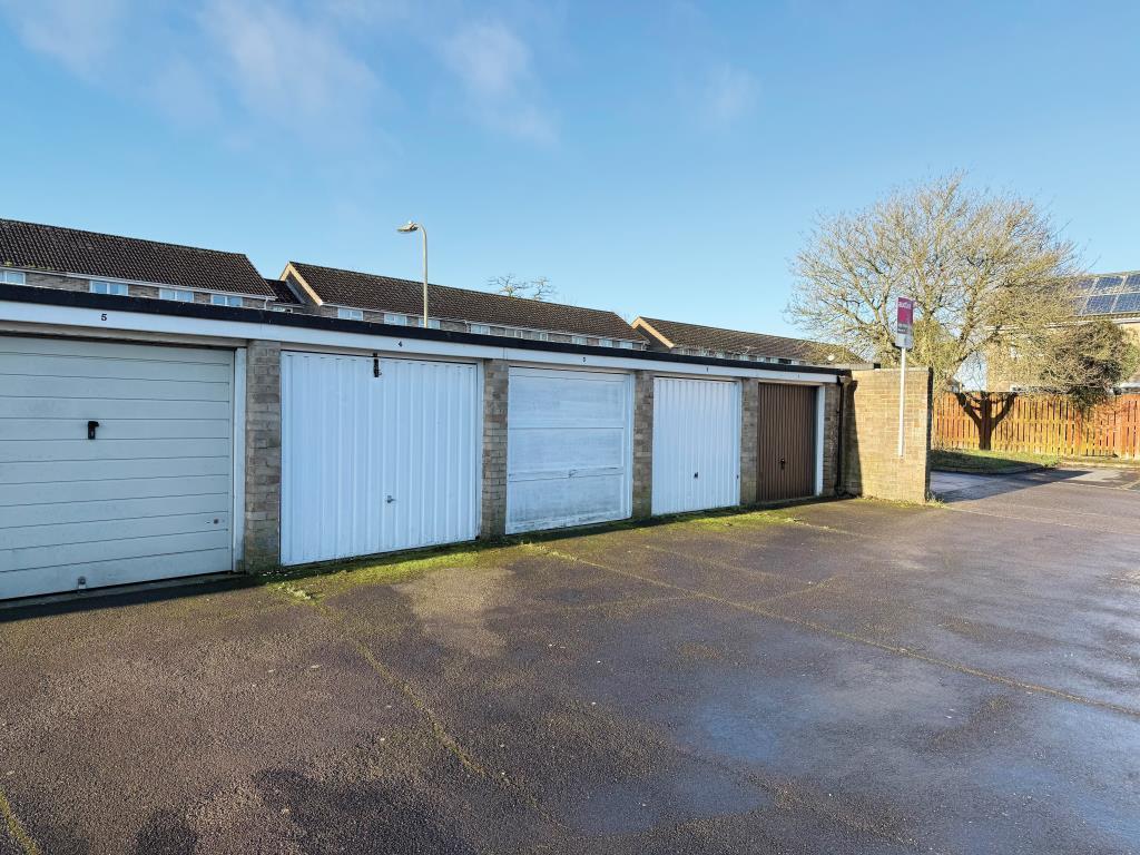View of garages with up-and-over doors