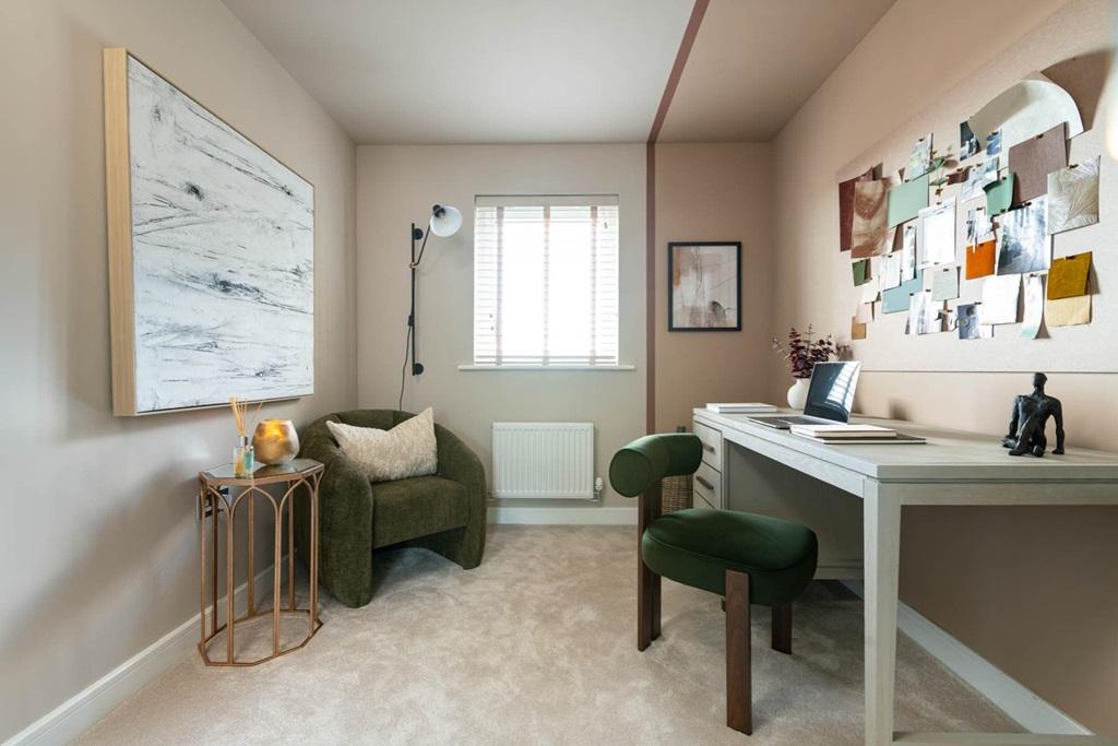 A comfortable extra bedroom offering room for...