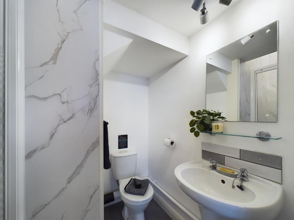 A modern bathroom featuring a large bathtub wit...