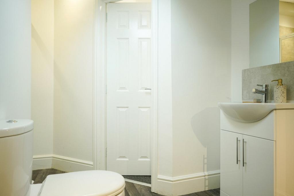 A bright and clean bathroom featuring modern fi...