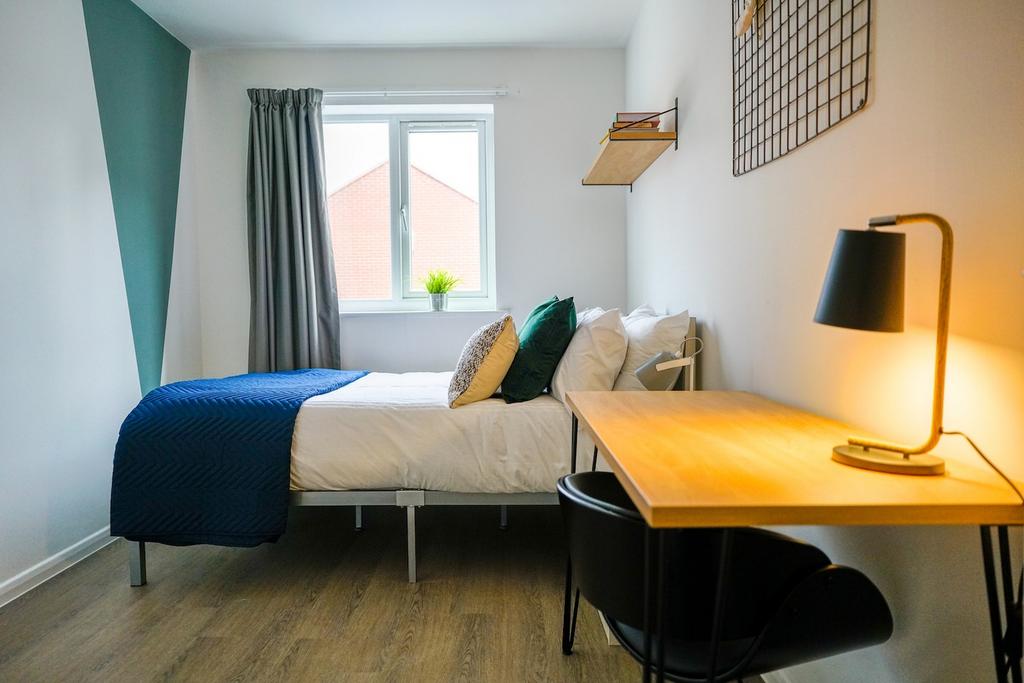 A bright and inviting double bedroom featuring ...