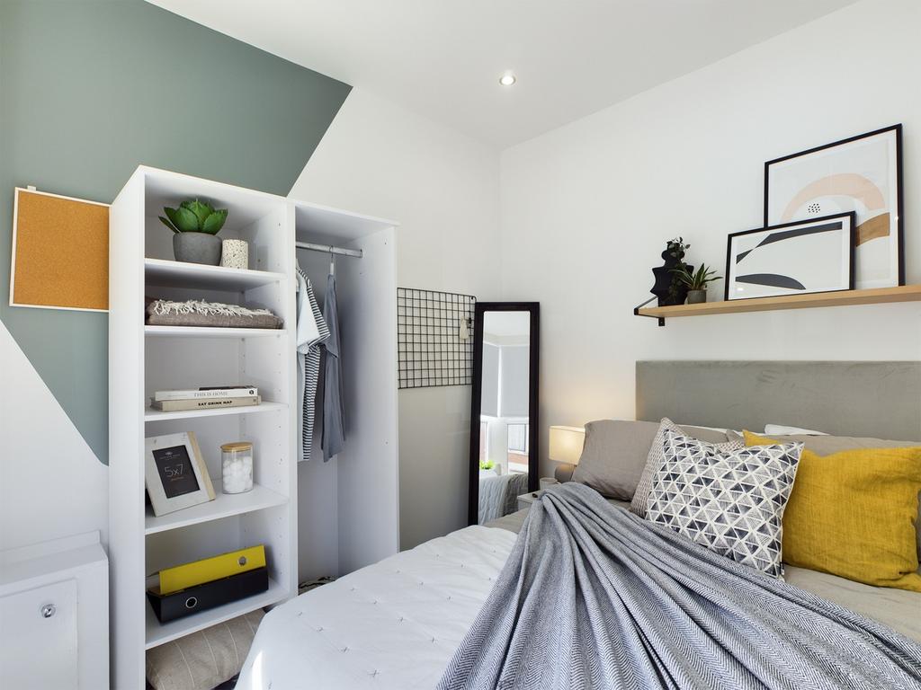 A stylish and well-organized double bedroom fea...