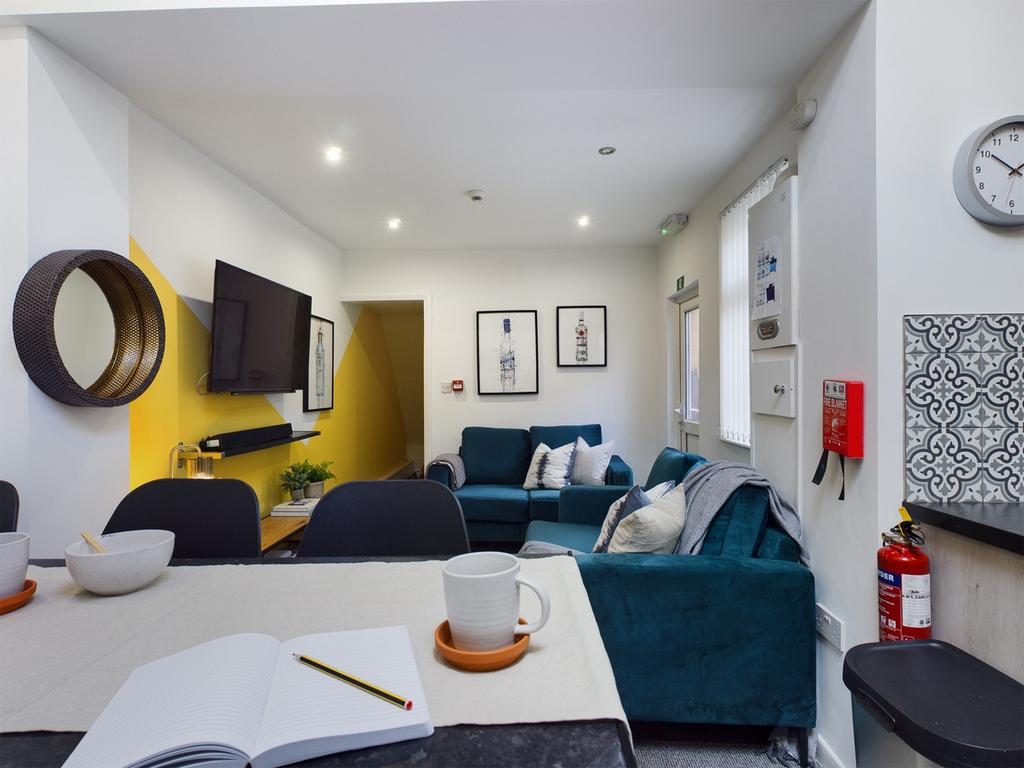 A spacious and inviting modern living room, per...