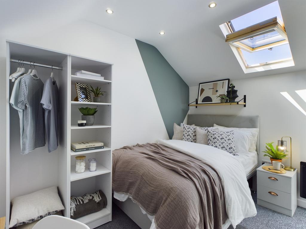 A stylish and bright double bedroom featuring m...