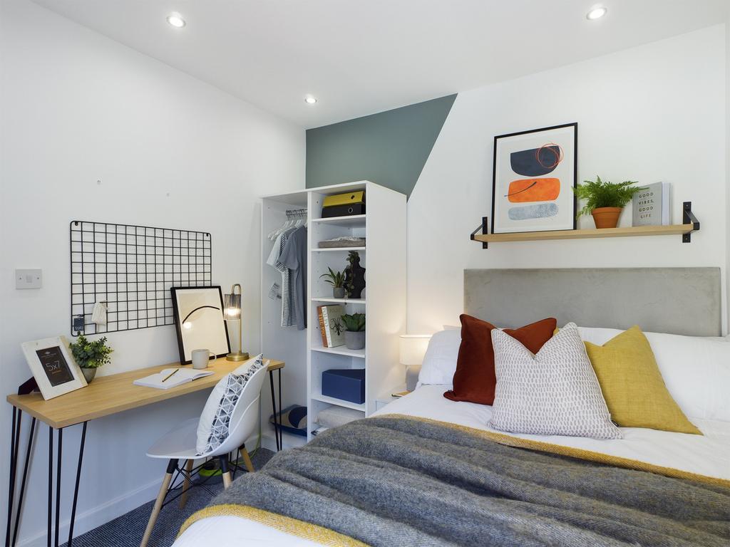 A stylish and inviting double bedroom with ampl...