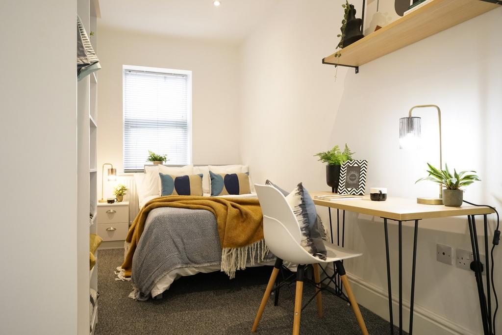 A stylish and inviting double bedroom featuring...