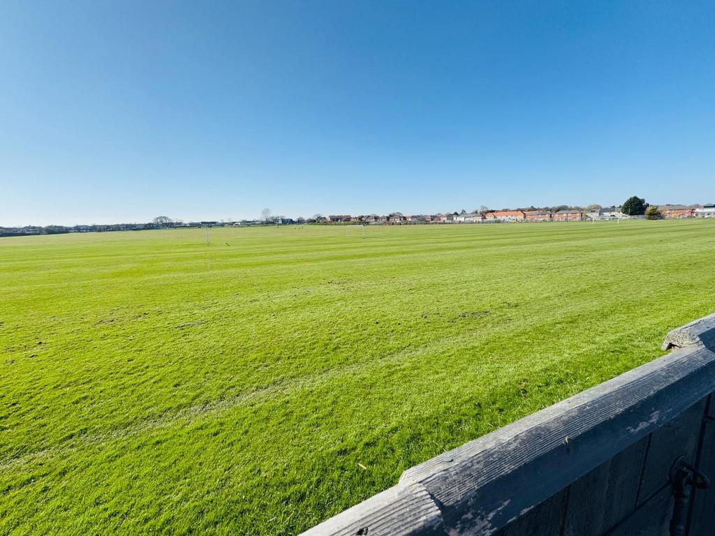 Playing fields to the rear