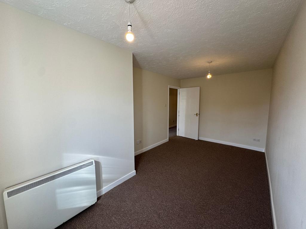 The bedroom is to the rear of the building