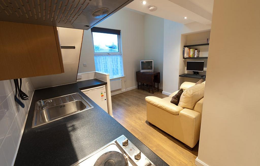 This charming kitchen area features modern appl...