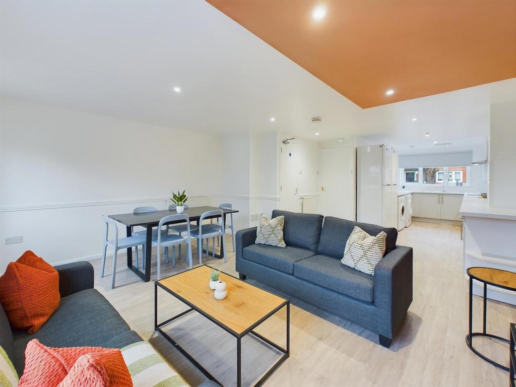 A spacious and modern living room perfect for s...