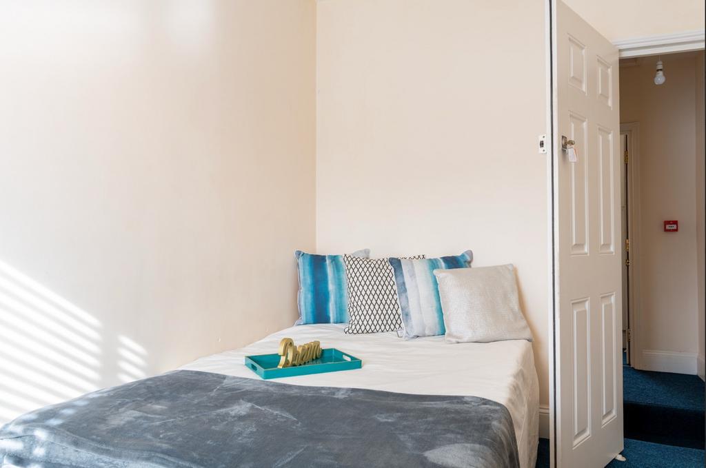 This inviting double bedroom features a cozy la...