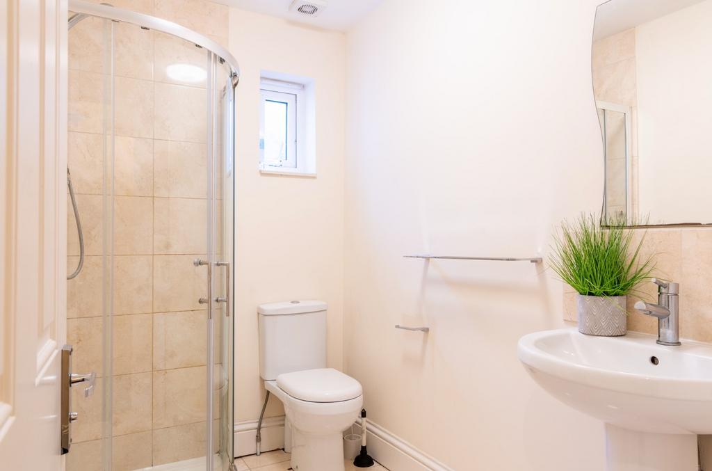 A modern bathroom suite featuring a spacious wa...