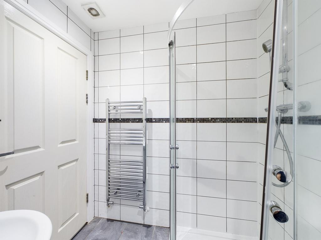A modern and pristine bathroom featuring a spac...