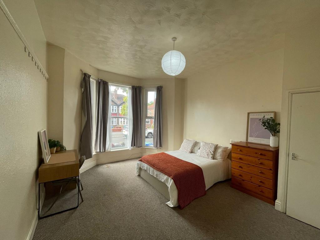 Bright and inviting master bedroom featuring a ...